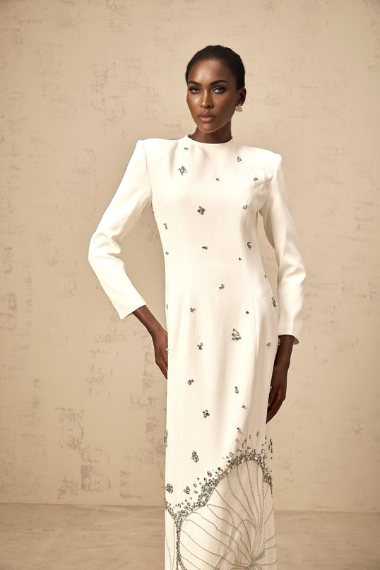 White maxi dress with lotus pattern embellishment named Daphne