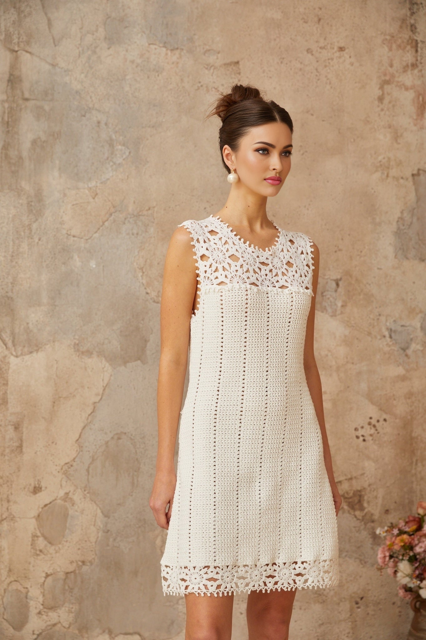White mini dress with floral applique and crochet knit design by Gisele