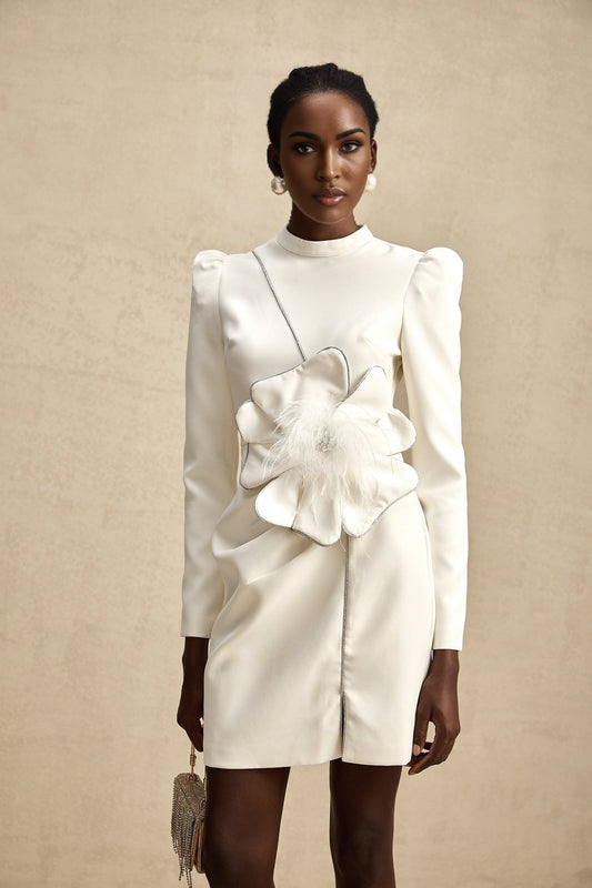 White mini dress with floral applique embellishments and short sleeves