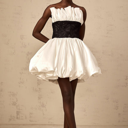 White mini dress with lace panels and puff sleeves made from satin fabric