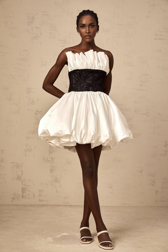White mini dress with lace panels and puff sleeves made from satin fabric