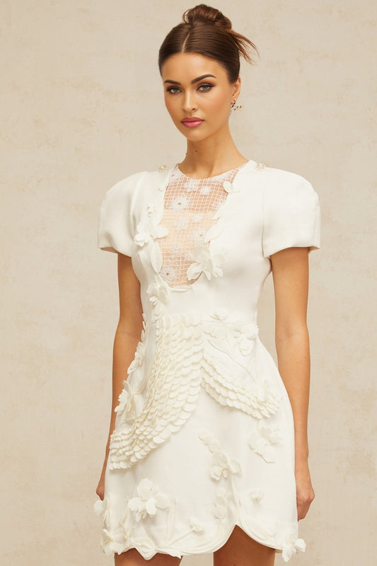 White mini dress with puffed sleeves and floral applique details named Frida
