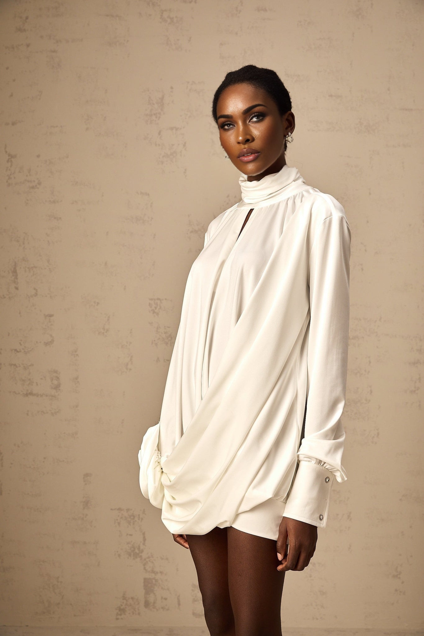 White mini dress with ruched detailing and faux flower embellishments named Maeva