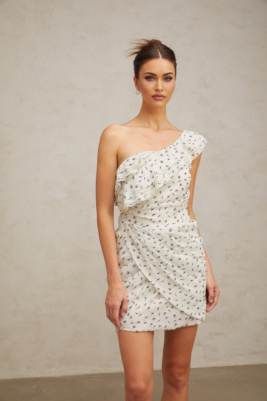 White mini dress with ruffles and printed pattern named Irina