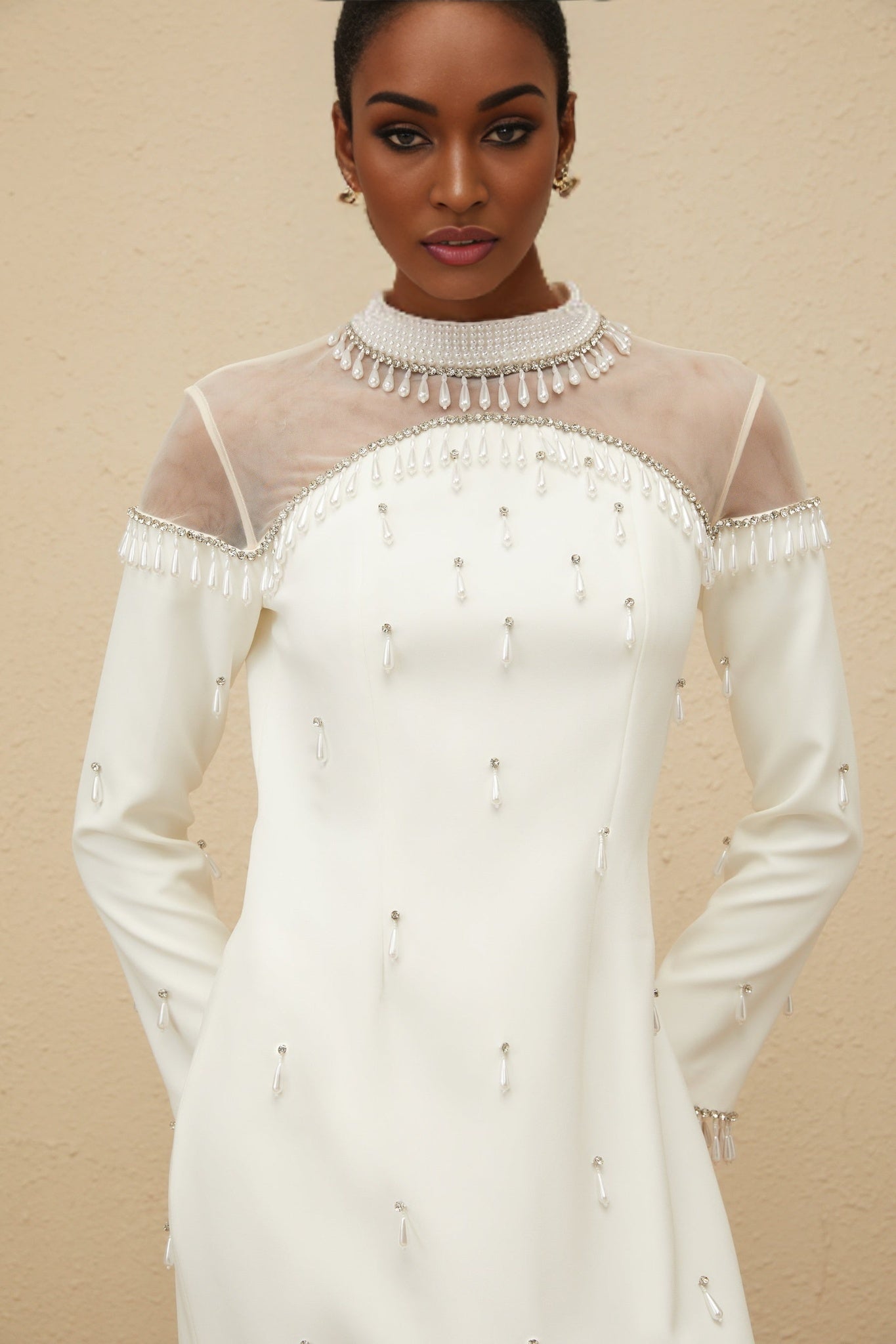 White mock neck long sleeve maxi dress with tulle and embellishments