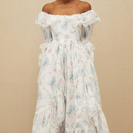 White off the shoulder maxi dress with floral print, flared cuffs, and lace trim