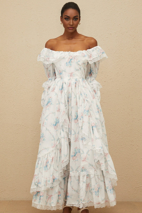 White off the shoulder maxi dress with floral print, flared cuffs, and lace trim