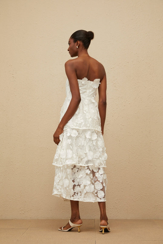 White off the shoulder sleeveless dress with 3D-petal and floral embroidered detailing, cinched waist, tiered skirt, rear zip fastening, midi length