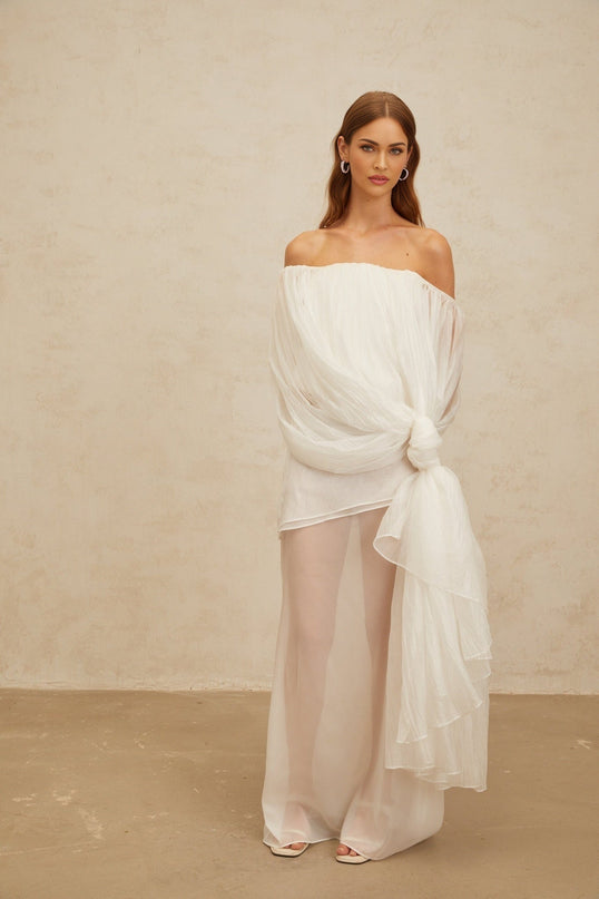 White off the shoulder sleeveless tulle top with twisted knot and asymmetrical design