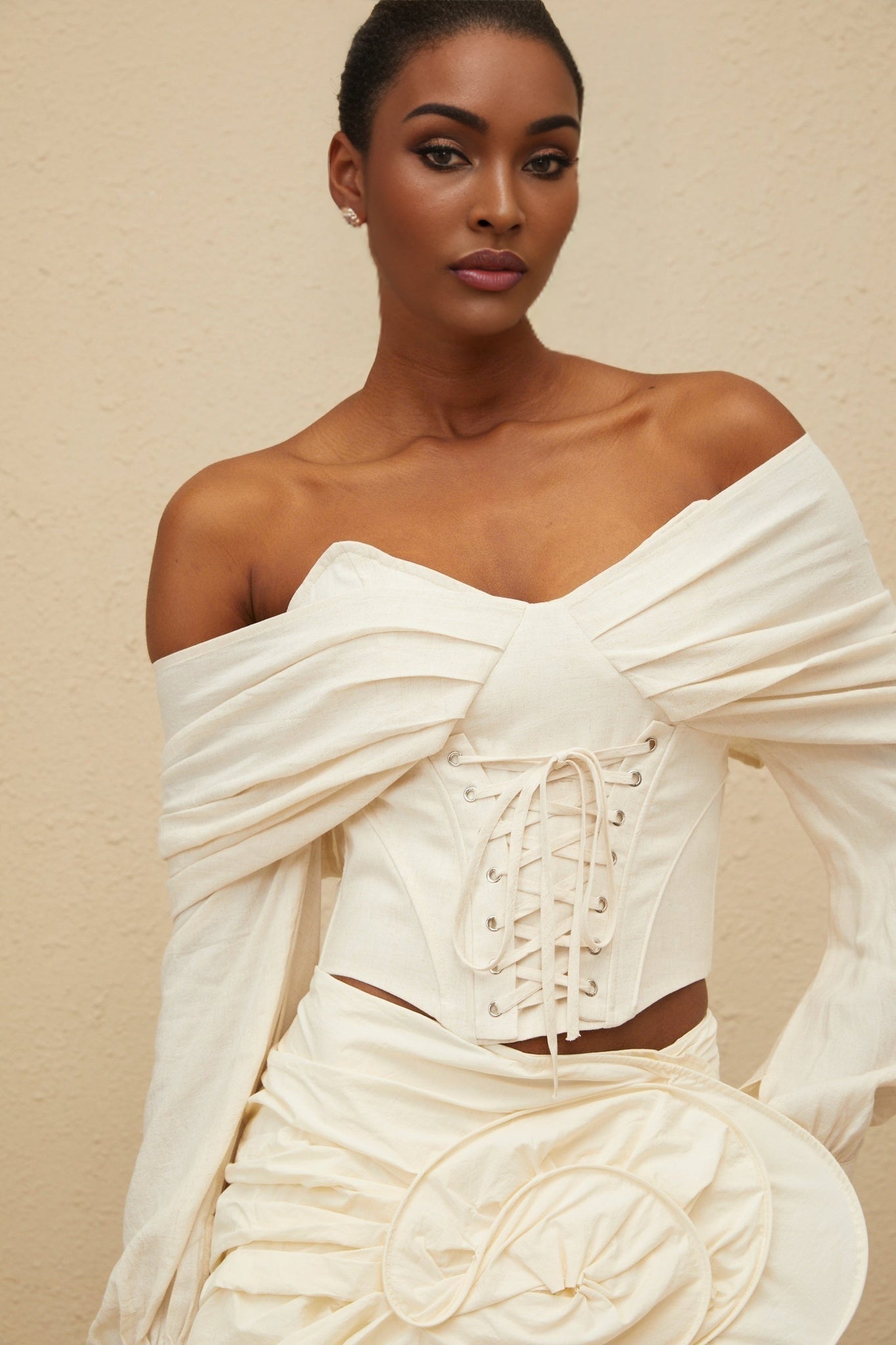 White off the shoulder cropped top with lace-up and ruched detailing
