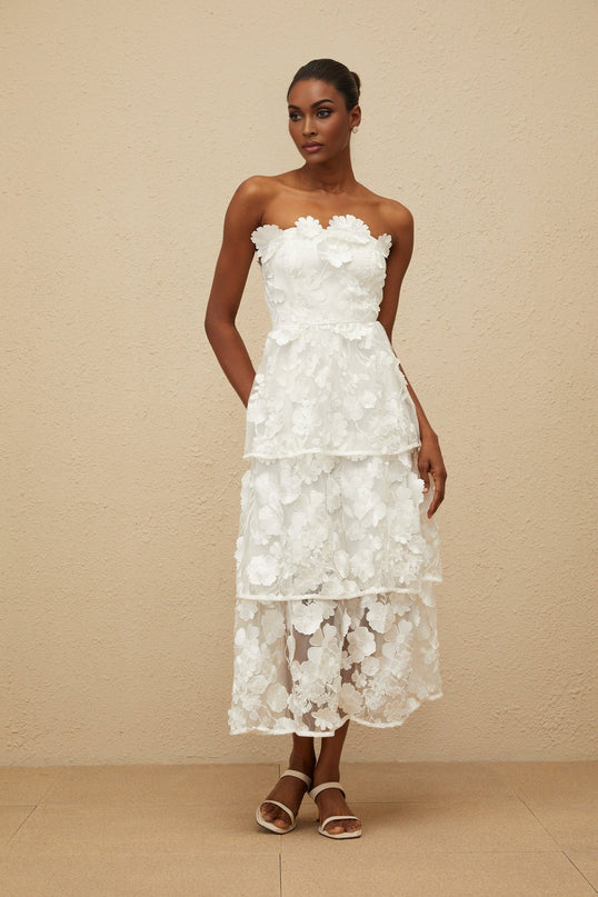 White off the shoulder sleeveless dress with 3D-petal and floral embroidered detailing, cinched waist, tiered skirt, rear zip fastening, midi length