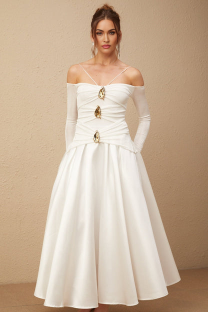 White offshoulder maxi dress with panels worn by model