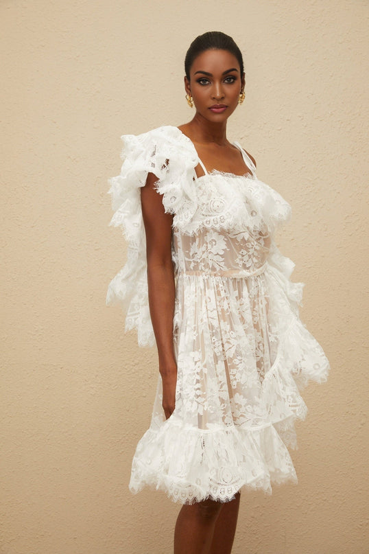 White one shoulder floral lace mini dress with ruffled detailing and asymmetrical design