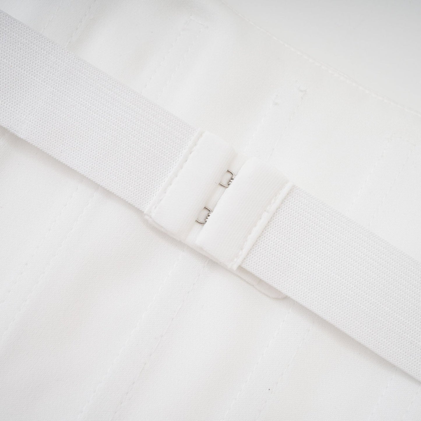 White ornate mini dress with Melisande design featuring decorative details and short length