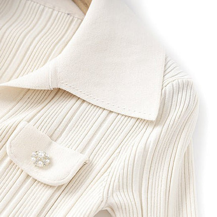 White ribbed knit button-down flared hemline top with collar and pockets
