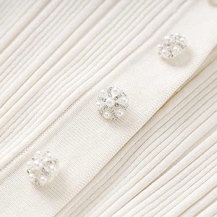 White ribbed knit button-down top with flared hemline