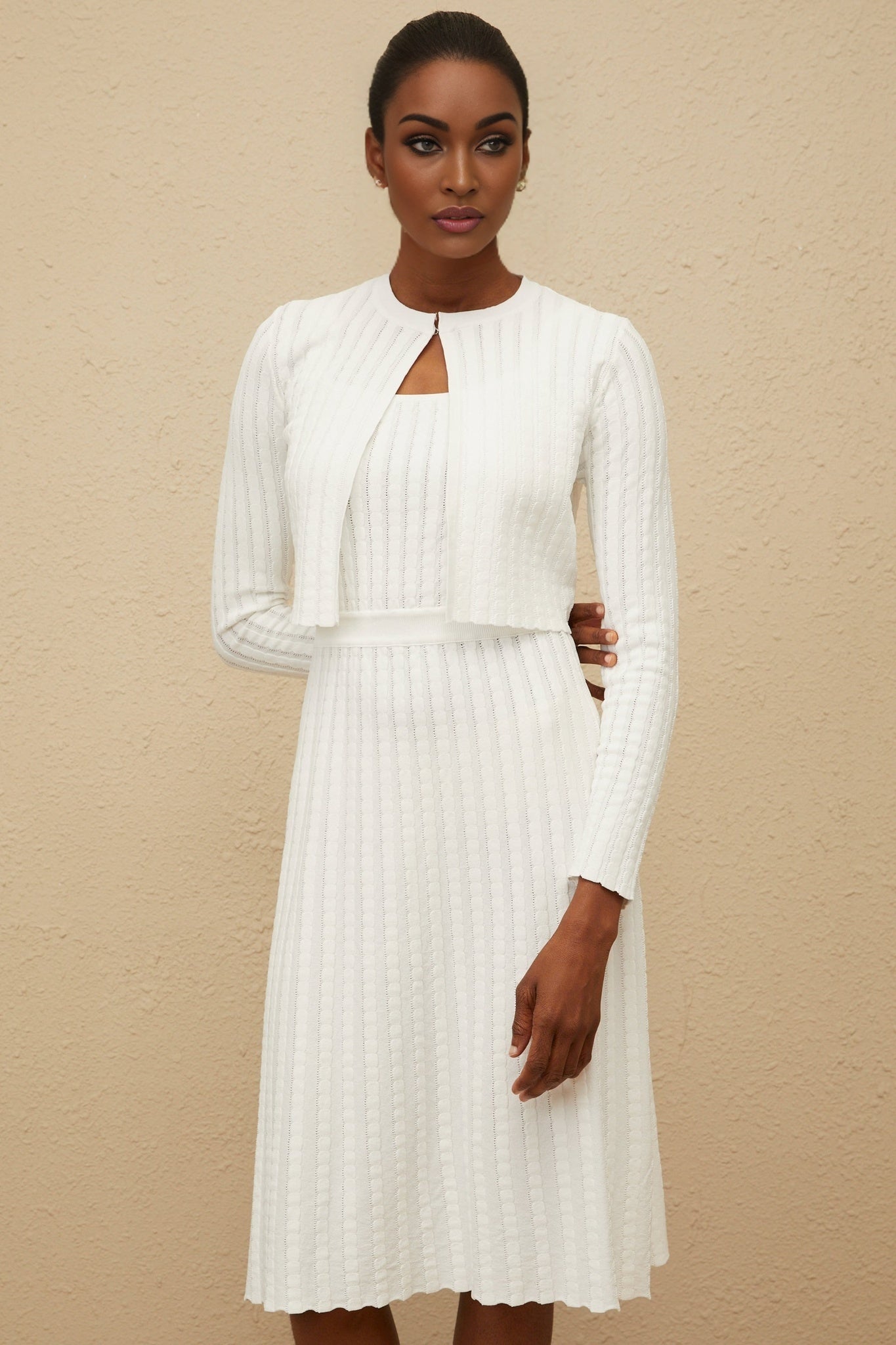 White ribbed knit cropped sweater with front hook fastening