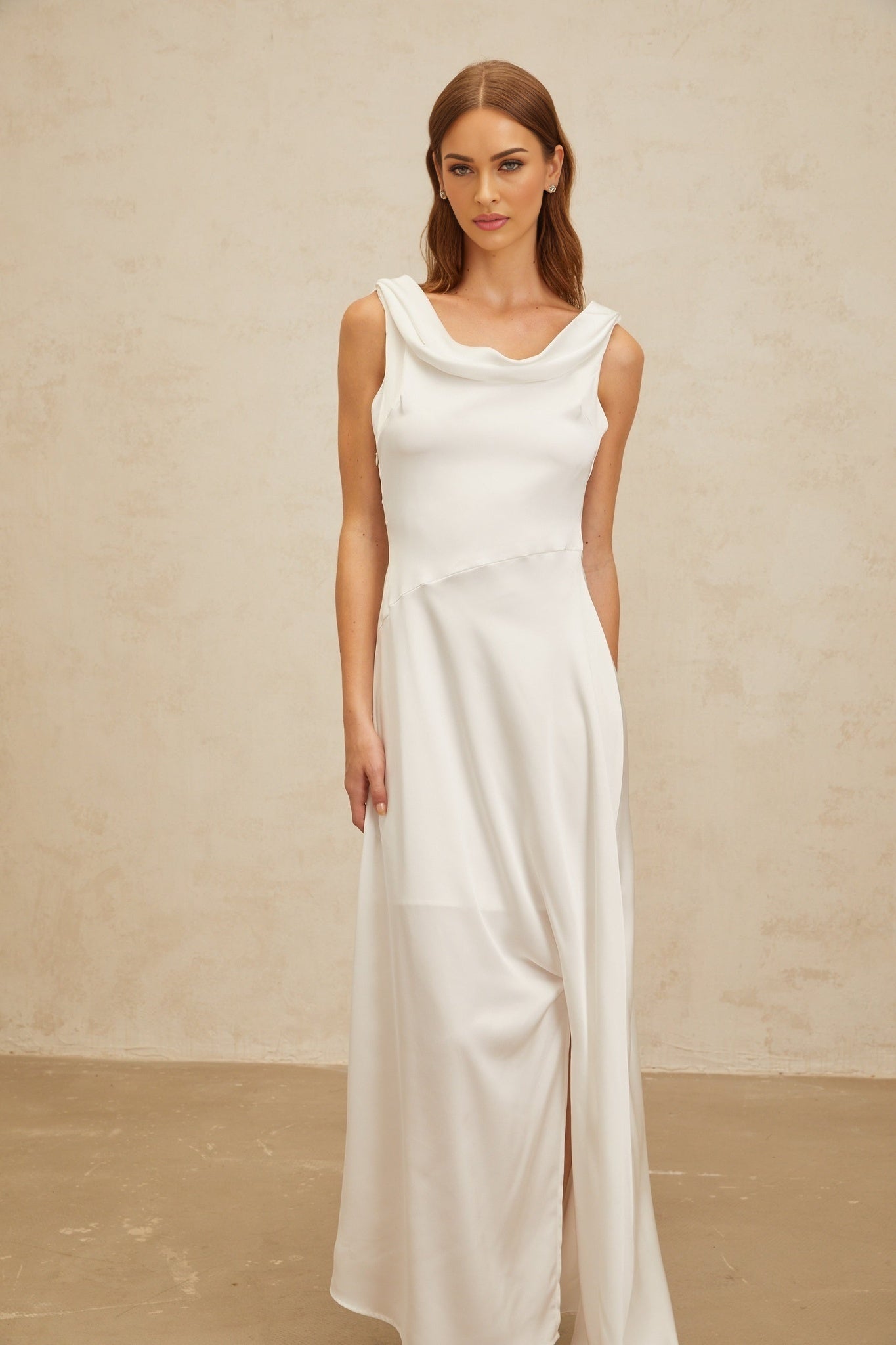 White satin cowl neck sleeveless maxi dress with twist detailing and side slit