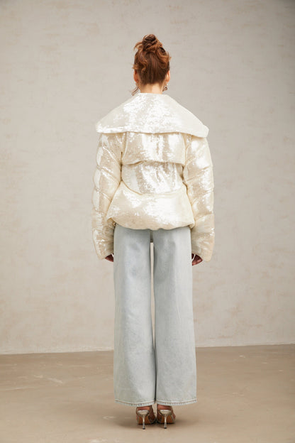 White sequined winter coat with down filling and long length featuring shiny embellishments