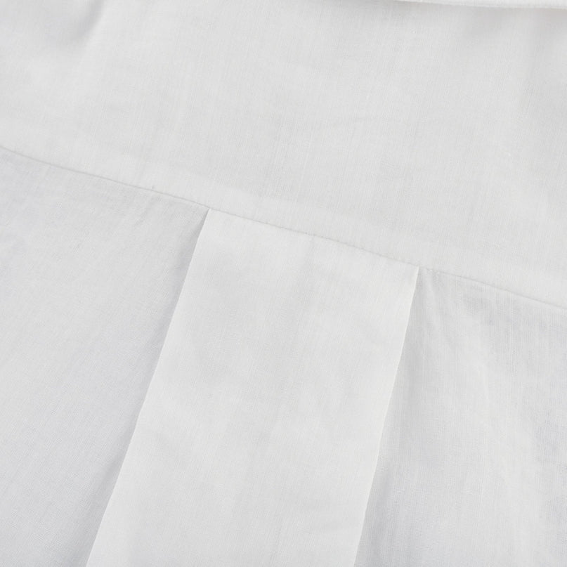 White shirt with lace embroidery details and cut out design on shoulders