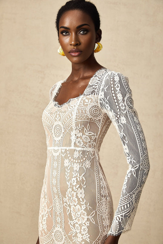 White short lace dress with scalloped hem and delicate floral pattern