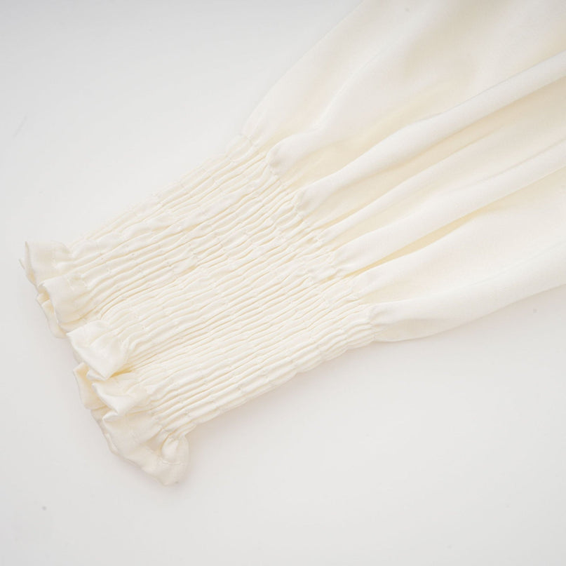 White short top with twist pattern and artificial flowers Nouria