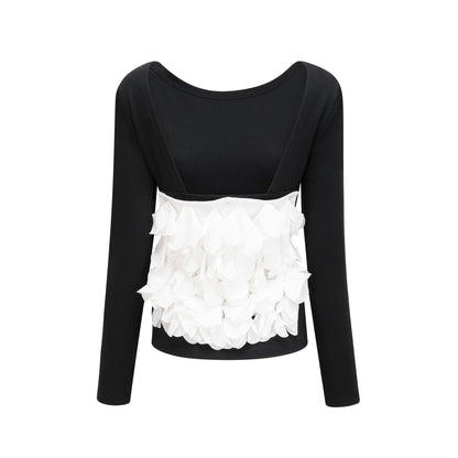 White sleeveless blouse with colorful floral embroidery on the front