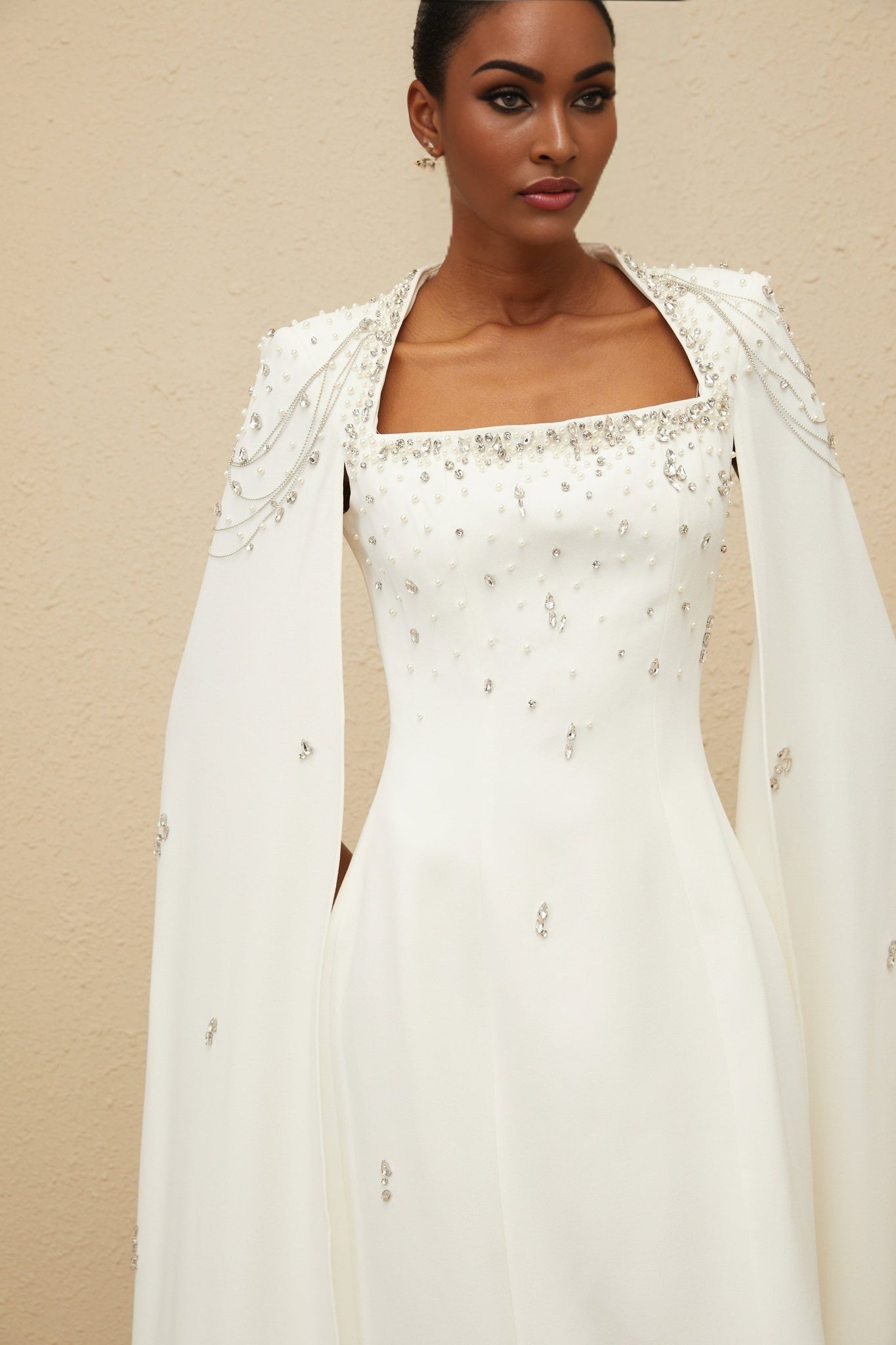 White Sleeveless Cape Dress with Embellishments and Fringed Detailing