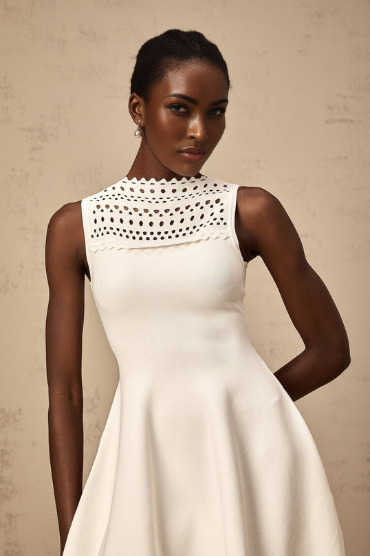 White sleeveless knitted mini dress with cut out details named Colette