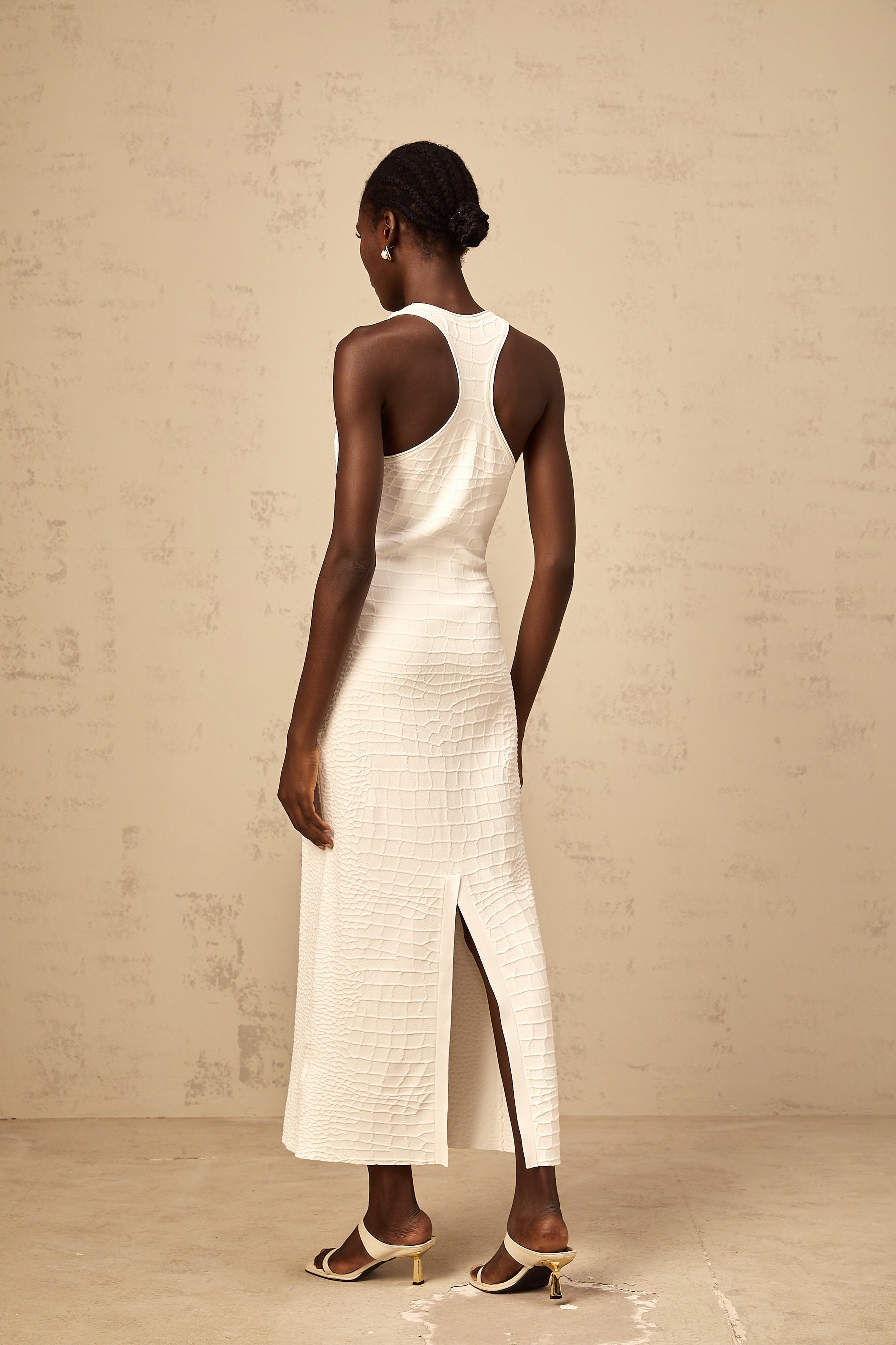 White sleeveless midi dress with textured jacquard fabric and tank top style