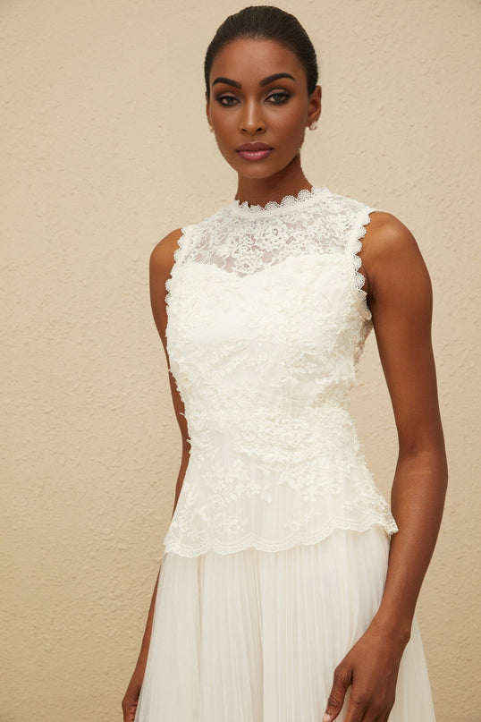 White sleeveless peplum waist dress with floral lace and sequin detailing