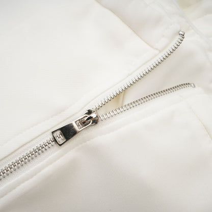 White sleeveless top with floral applique details named Lucie