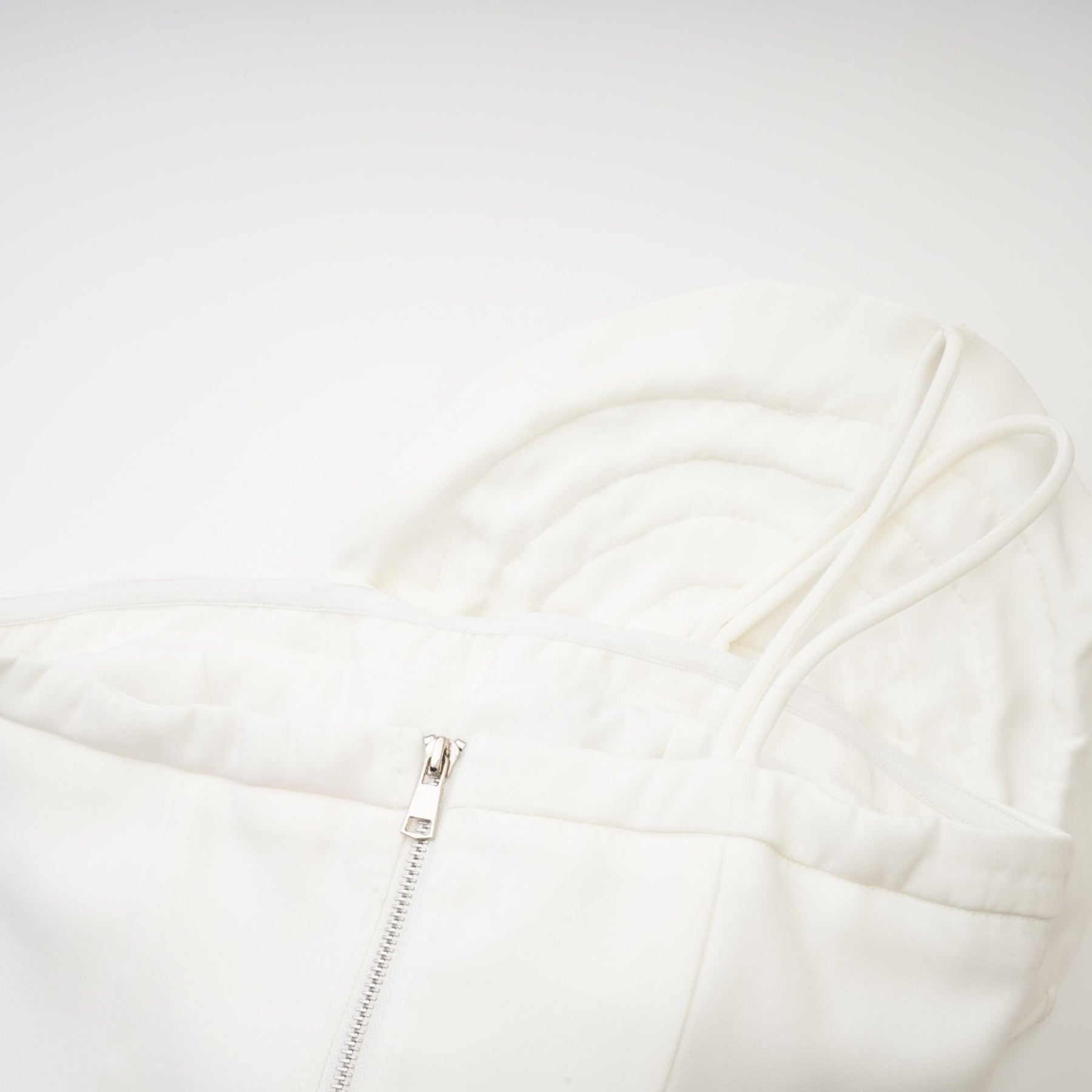 White sleeveless top with floral applique details named Lucie