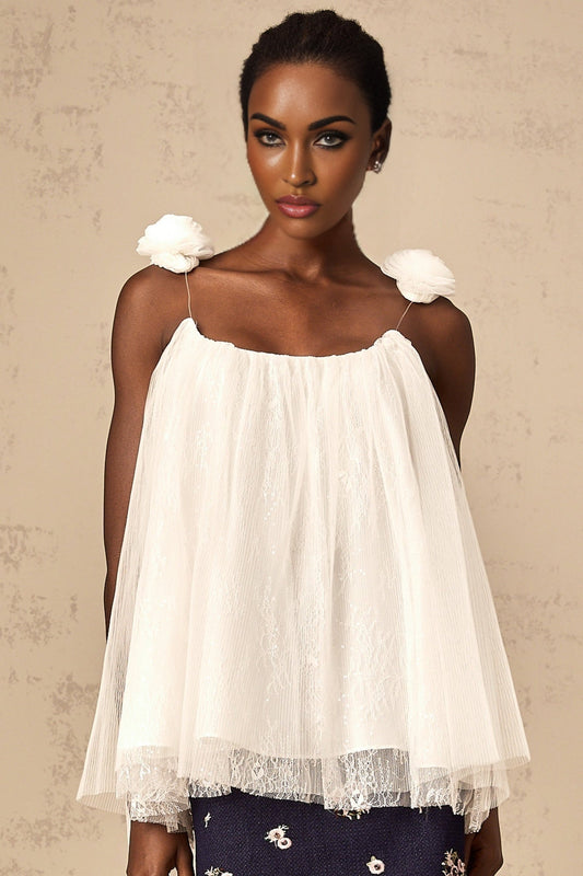 White sleeveless top with floral mesh overlay and flower appliques