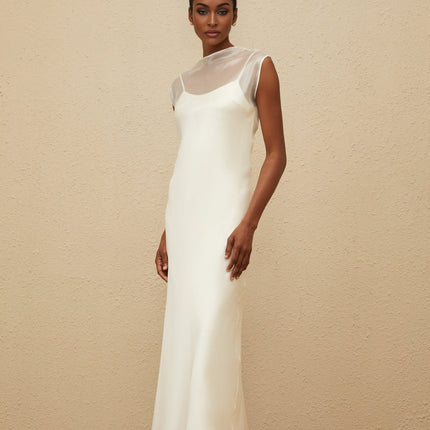 White sleeveless tulle maxi dress with flared hem and round neck
