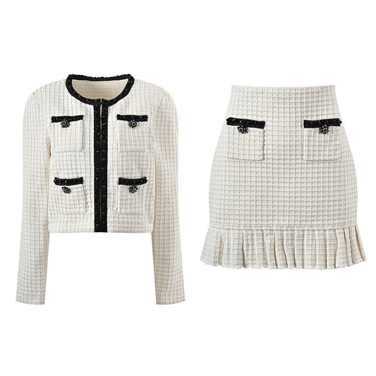 White tailored jacket and flared skirt with black accents