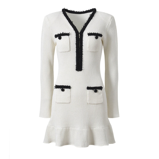 White textured knit v-neck dress with black trim and patch pockets