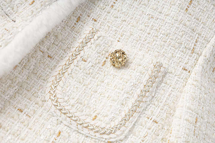 Elegant white tweed coat with fur trim and gold accents
