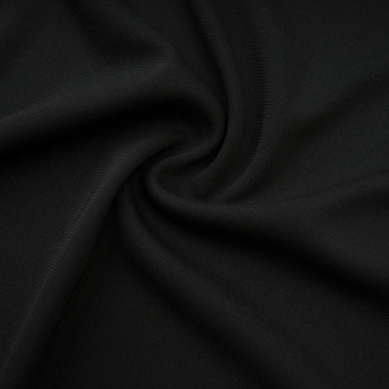 Winter Black Logo Motif Winter Skirt with Cut Out Detailing Flared Design Midi Length Asymmetric Hem Two Side Slits Rear Hook and Zip Fastening 88% Viscose 12% Spandex