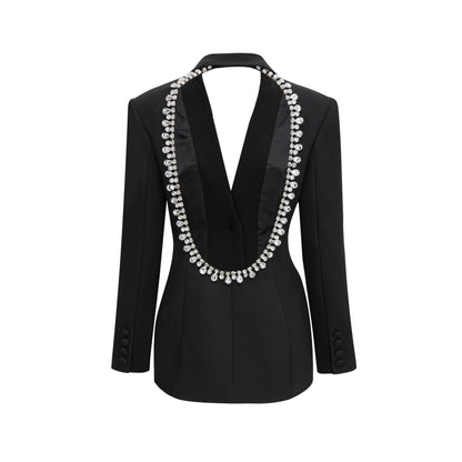 Black dress with long sleeves notched lapels scoop back buttoned cuffs fitted waistline crystal embellishment and front button fastening