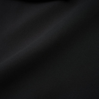 Black dress with long sleeves notched lapels scoop back buttoned cuffs fitted waistline crystal embellishment and front button fastening composed of 100% Polyester