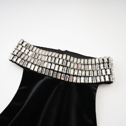 Sleeveless black dress with embellished crystal turtle neck ankle length rear zip fastening and side slit Made of 100% Polyester