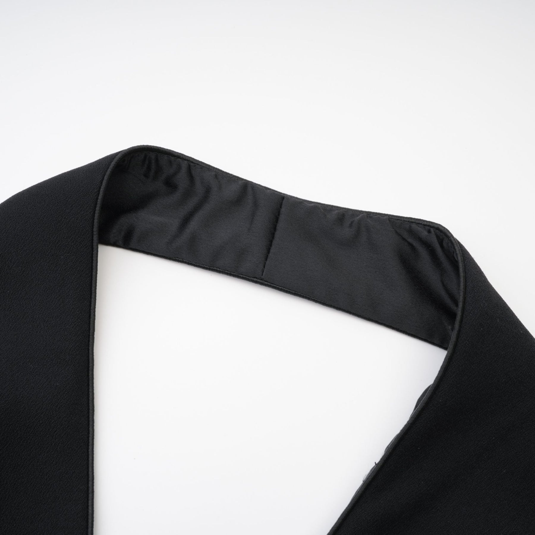 Bold black dress with an elegant sleeveless cut sophisticated halter neck and front golden button design for added glamour ending at a daring thigh length  80% Polyester 20% Cotton for comfort and style