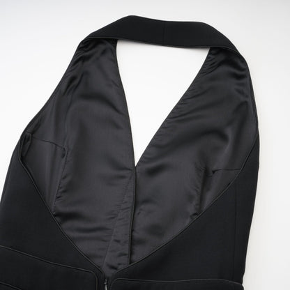 Sleek black dress with stylish halter neck sleeveless cut  golden front buttons Zip fastened  ends at thigh length 80% Polyester 20% Cotton for comfort