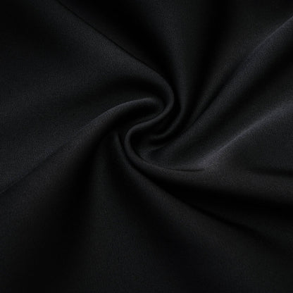 Anklelength black dress with spaghetti straps flower decoration at neck open back and 100% Polyester composition
