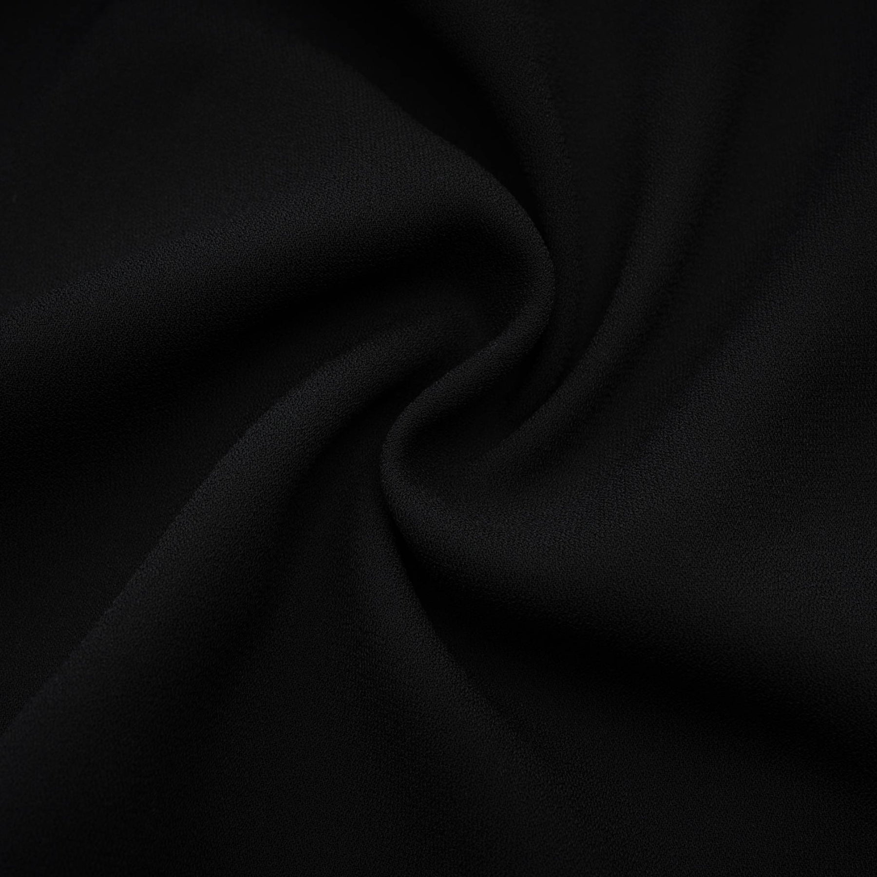 A black floral dress with spaghetti straps square neck and rear zip fastening featuring a flower decoration at the neck and an asymmetric design crafted from 80% Polyester and 20% Cotton