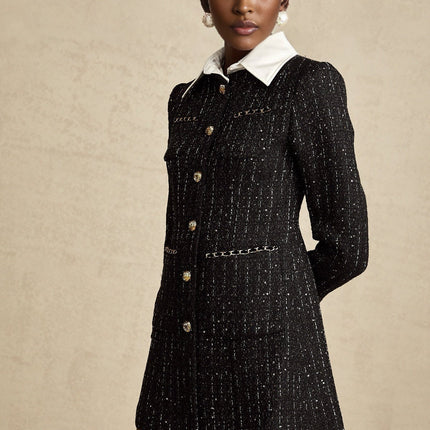 Woman wearing a black mini dress with sequin panels and tweed fabric Audrey style short sleeves fitted silhouette