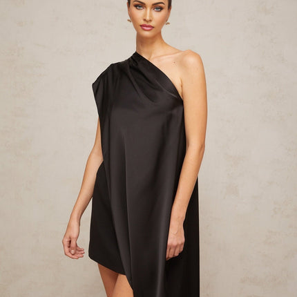 Woman wearing a black oneshoulder mini dress suitable for Valentines Day occasion