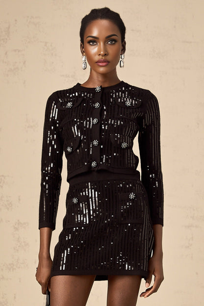 Woman wearing a black sequined ribbed knit cardigan and matching skirt set with shimmering details