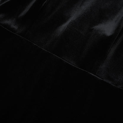 Black crystalembellished sleeveless dress with a roll neck
